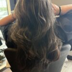 Classic Sassoon long and low layered haircut with Custom Hair Color using a money piece and Babylights.